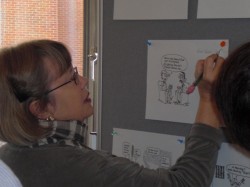 participant writing on cartoon