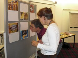 workshop participants looking at images